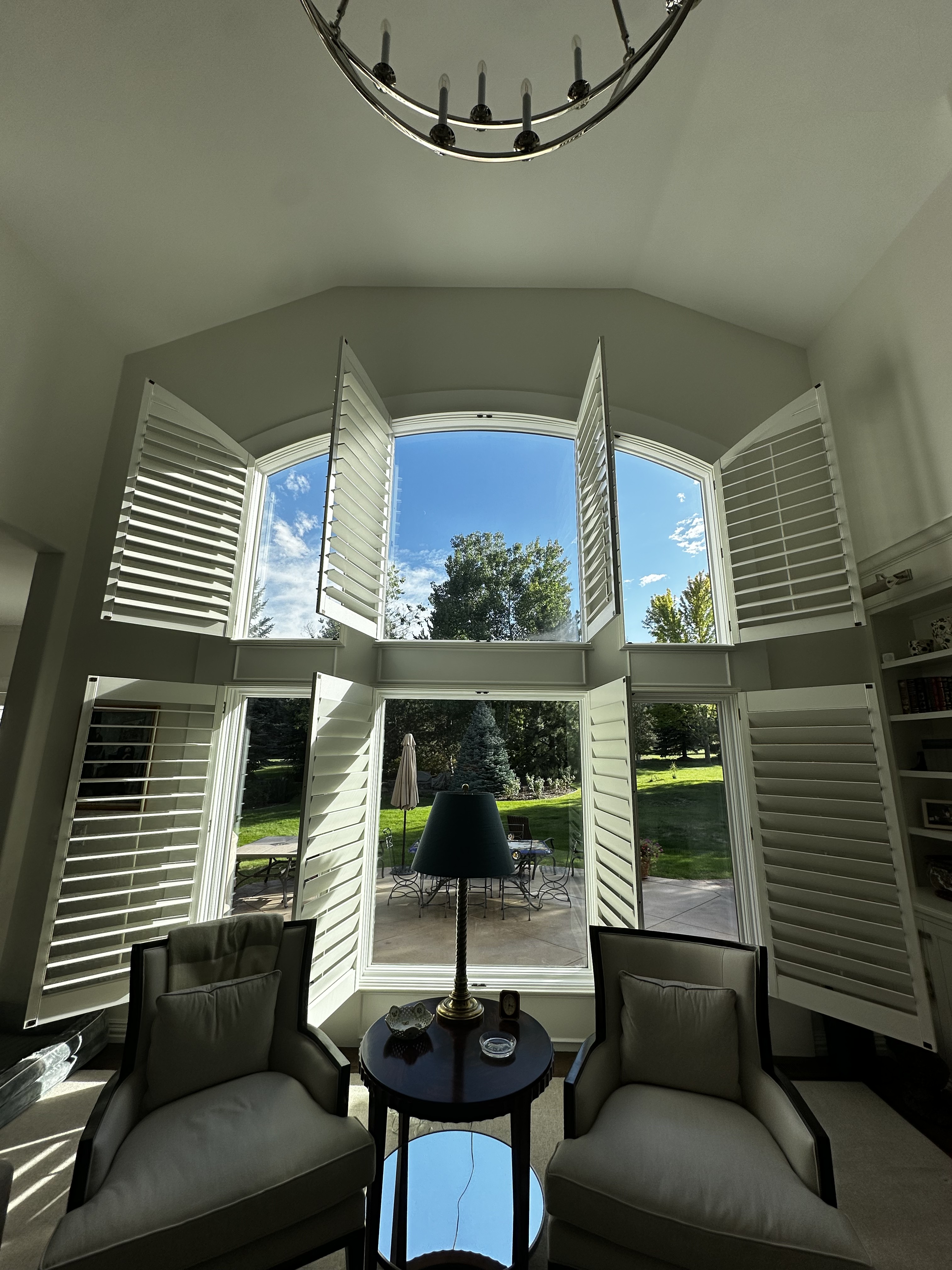 Sitting room framed by a clean projecting bay window