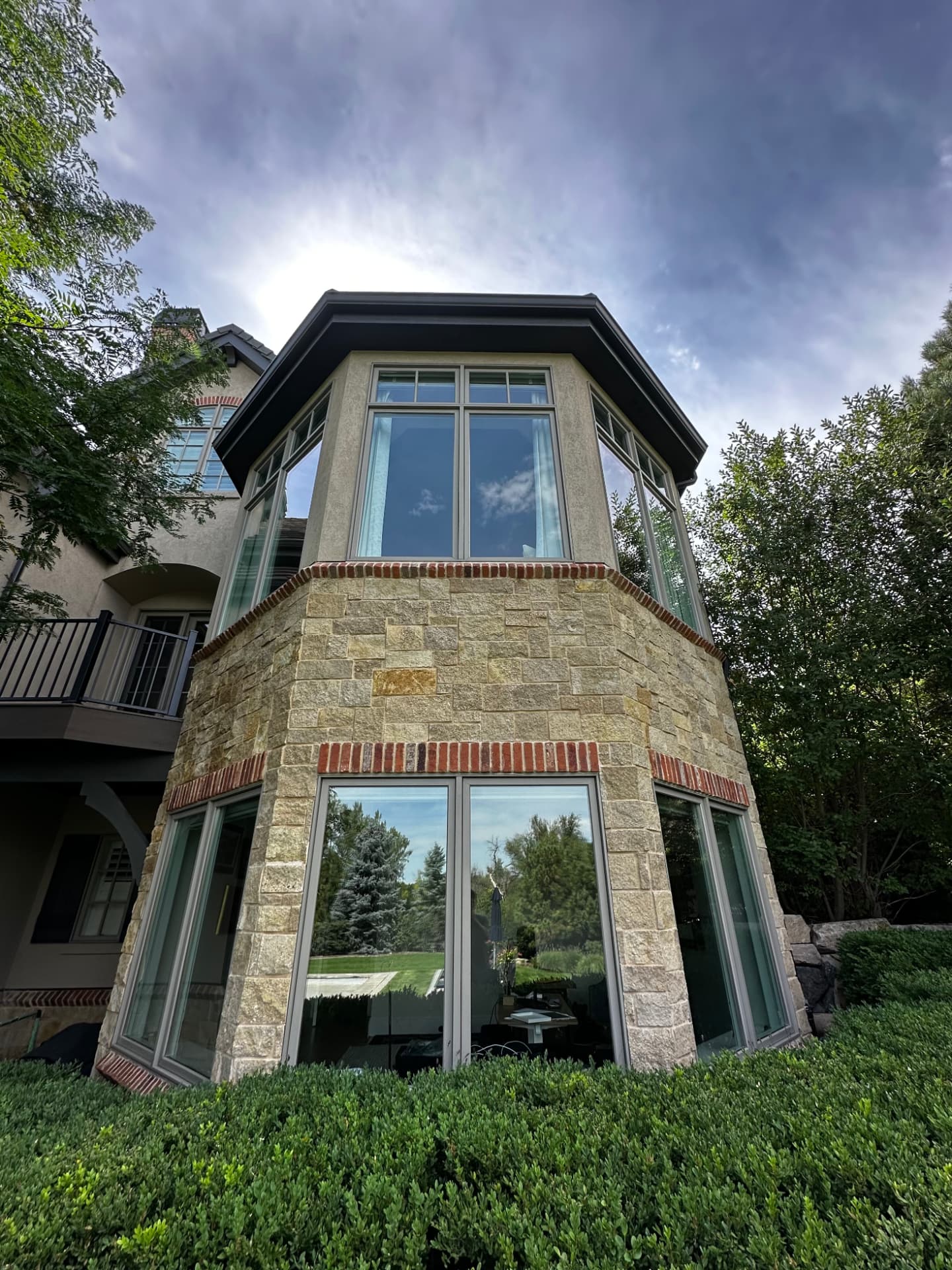 Two-story projecting window bay on a stone residence